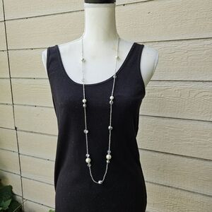 long clear seed bead necklace with faux pearl and crystal stations